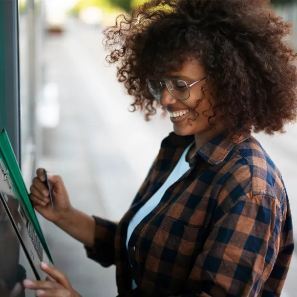 Woman withdrawing money from an ATM