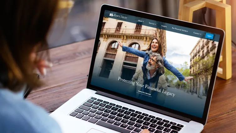 Laptop with the Essex Trust website visible