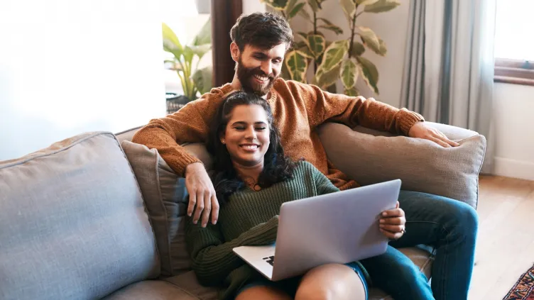 Couple reviewing their mortgage application online