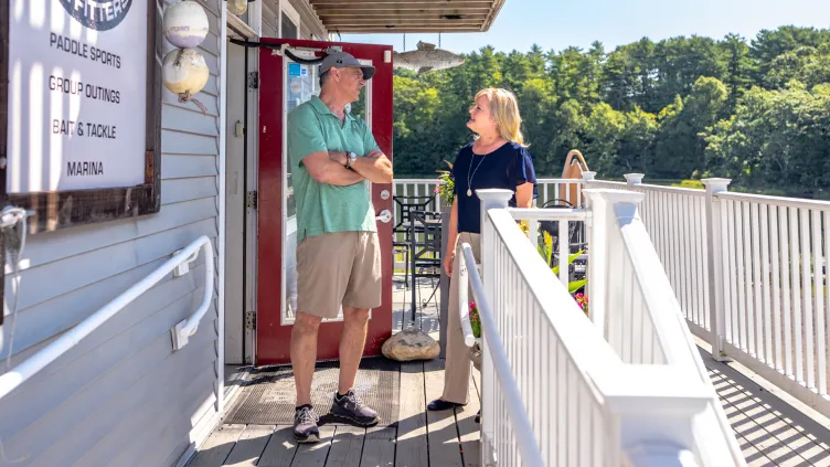 Essex Bank officer with Gene Chmiel of Black Hall Outfitters